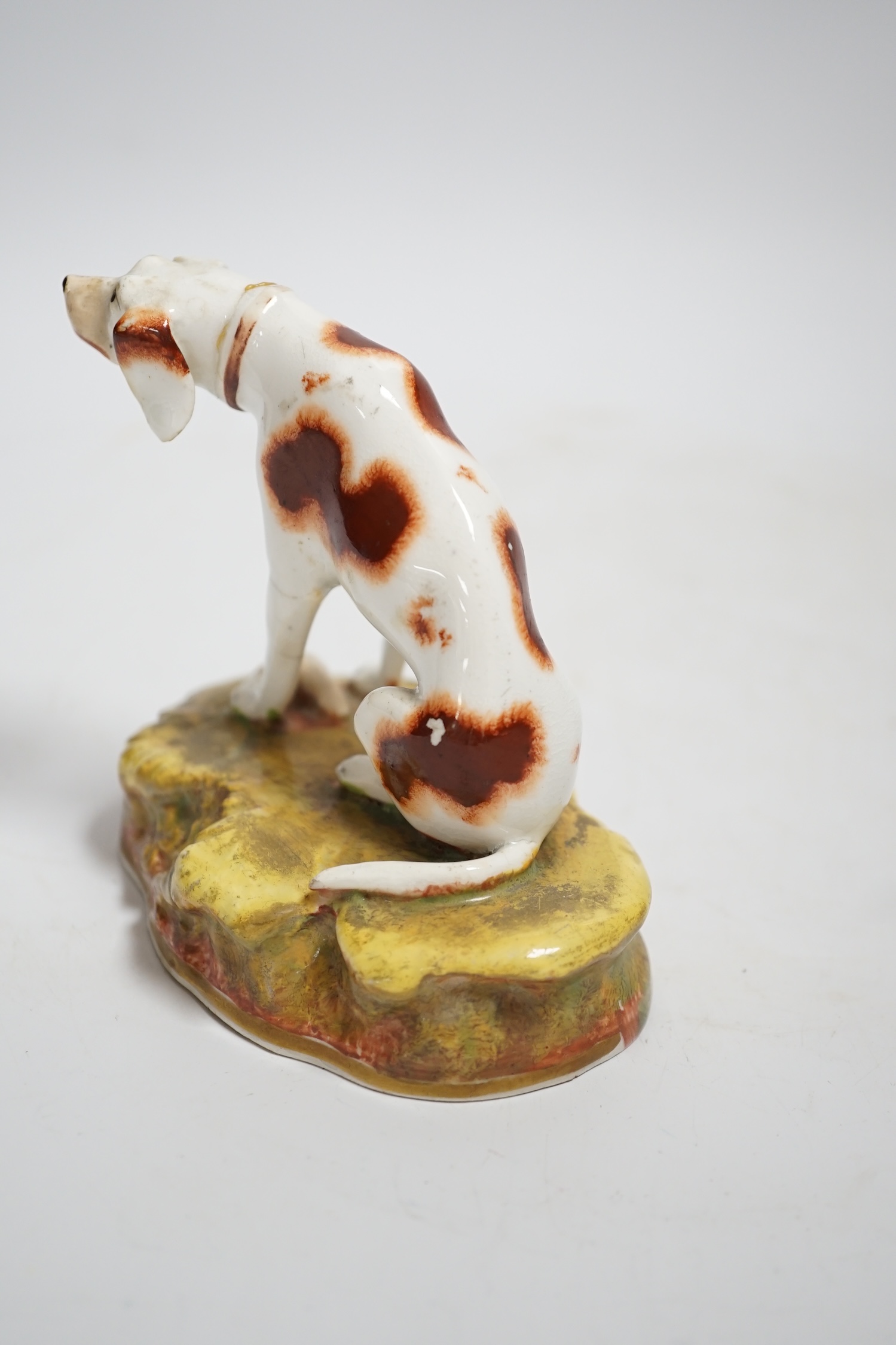A rare Staffordshire porcelain model of a pointer, c.1830-50, 10cm high